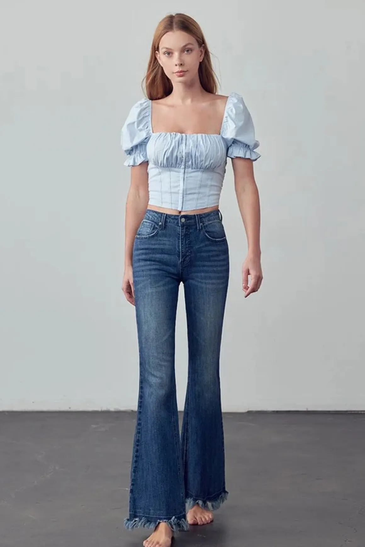 frayed_hem_flare_jeans_on_2.webp Frayed Hem Flare Jeans *Online Only*