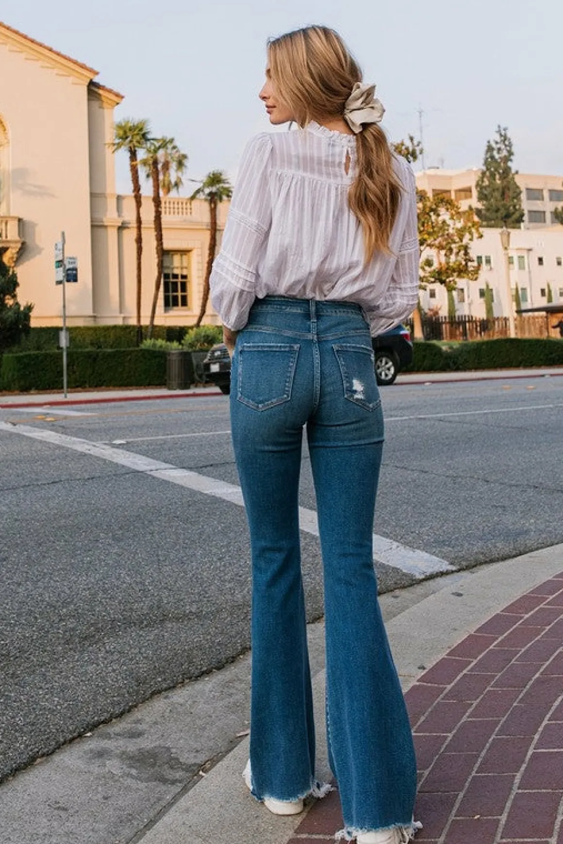 high_rise_distressed_raw__3.webp High Rise Distressed Raw hem Flare *Online Only*