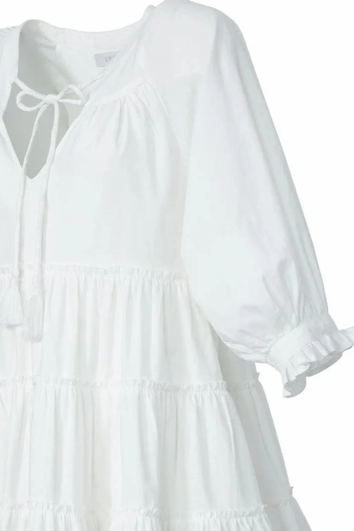 tiered_mini_dress_with_ta_10.webp Tiered mini dress with tassel *Online Only*